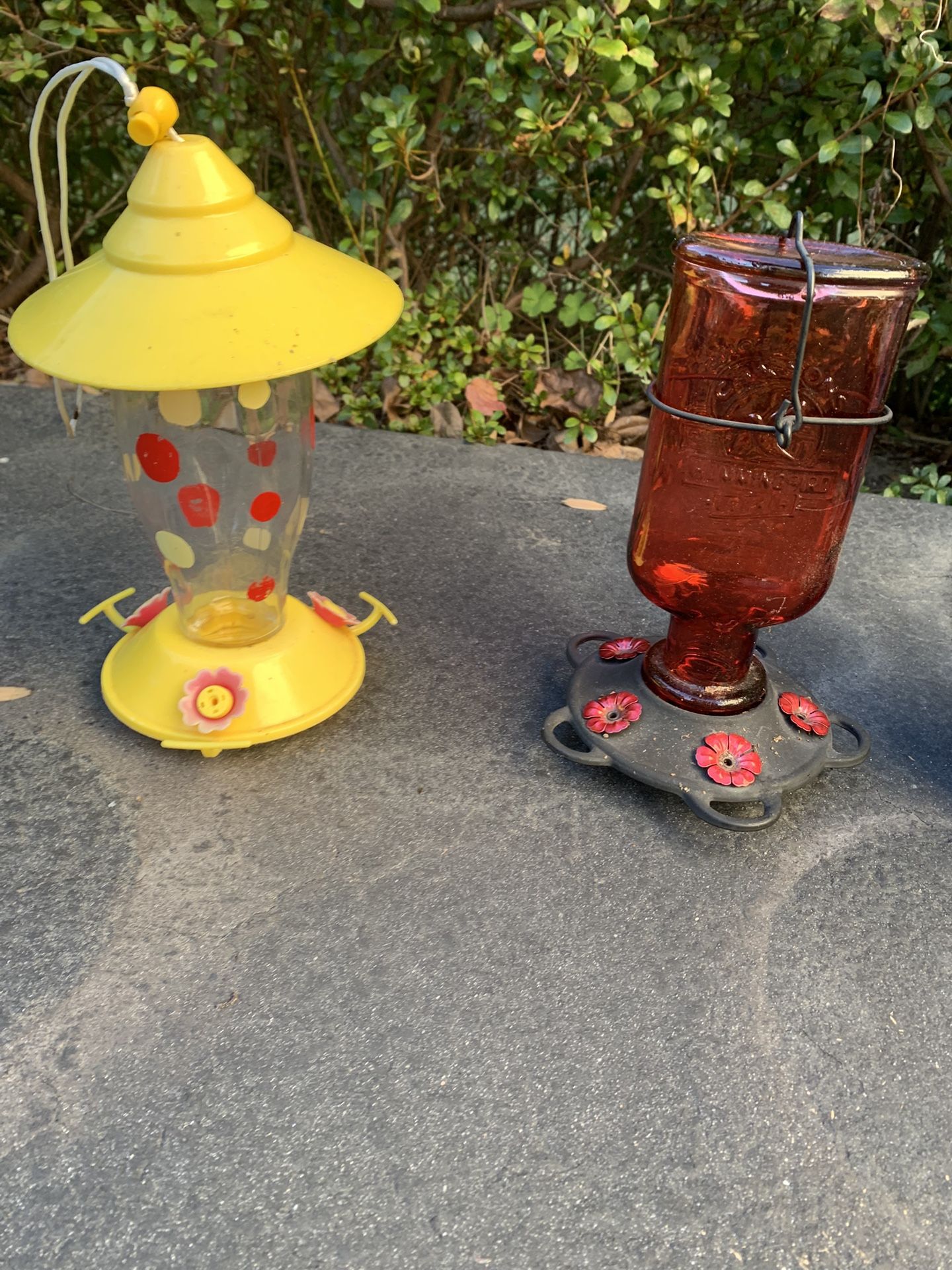 Two Humming Bird Feeders