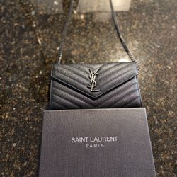 Authentic Saint Laurent Monogram Envelope Chain Bag in classic black. Crafted from premium grained calfskin leather with chevron quilting and tonal bl