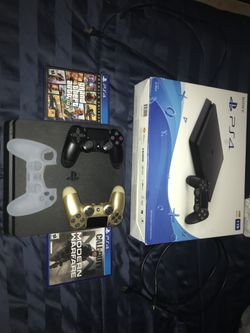 PlayStation 4 gold and black controller and grip and 2 games