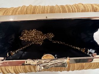 Gold colored formal handbag. New. Never used.