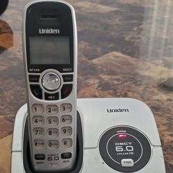 Uniden DECT1560 cordless phone with power cord and phone cord