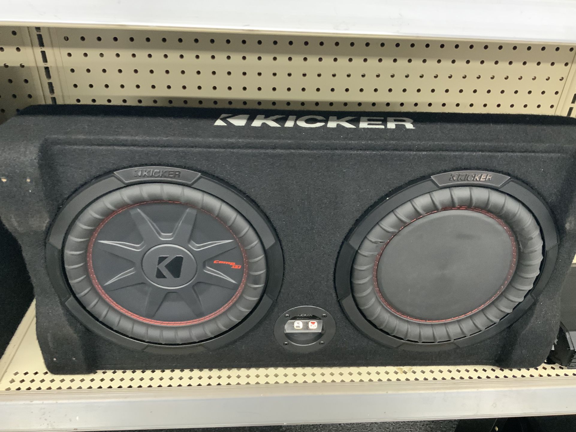 Kicker Sealed downward-firing enclosure with CompRT 10" shallow-mount subwoofer