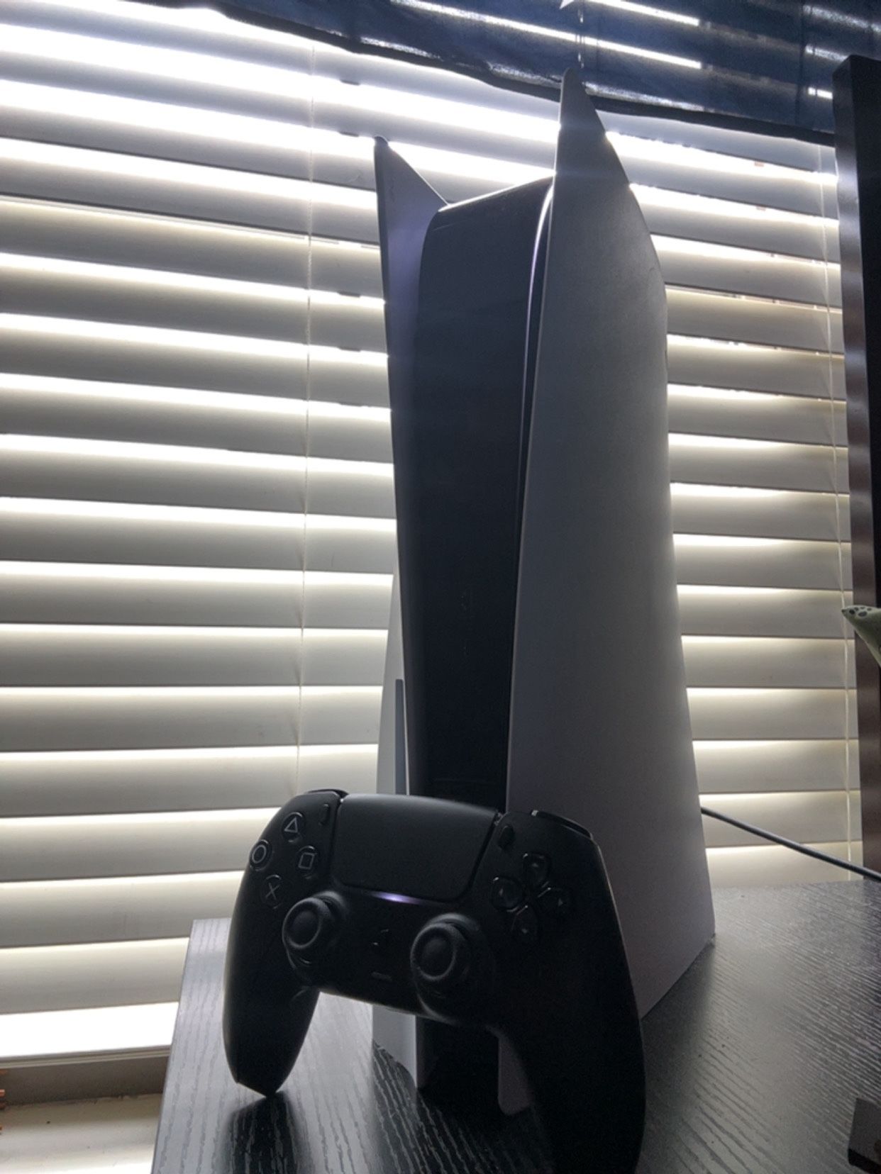 Sony PlayStation 5 With A Black Controller