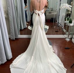 White Sleeveless Plunge Neck Wedding Gown