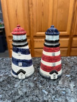 Vintage Ceramic Lighthouses  Salt & Pepper Shaker Set. Size approximately  4 inches tall.  Brand new never used with tags on the bottom.  Brand Enesco