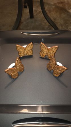 Four brown wooden napkin holders. Like new