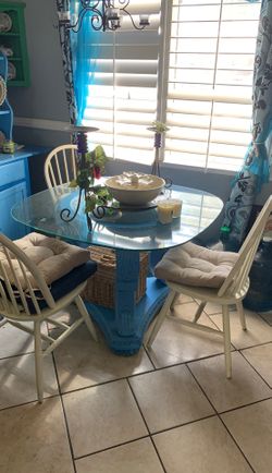 Glass table and 3 chairs $50