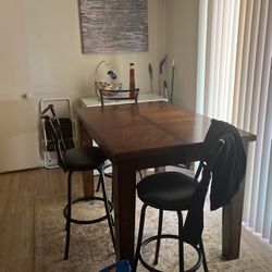 Dining room table with three chairs