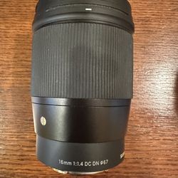 A Sigma 16mm f/1.4 DC DN Contemporary camera lens. I have 2, $225 each