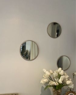 Set of three  round golden mirrors