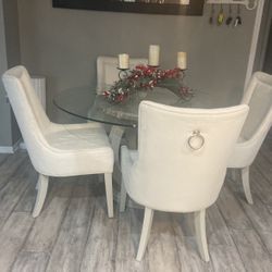 Wood dining table with four chairs in glass and tap