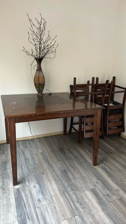 Table chairs lamp flower light vase