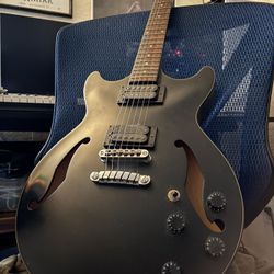 AM73B is an Artcore series hollow body electric guitar model