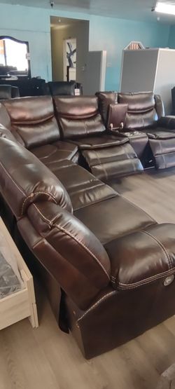 New sectional sofa with three power recliners on sale now. don't miss