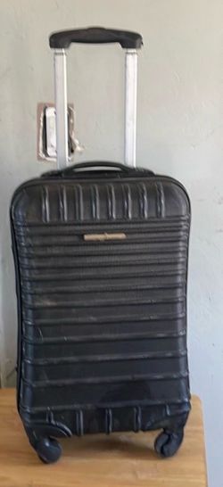 Luggage fits on top of airplane comportment