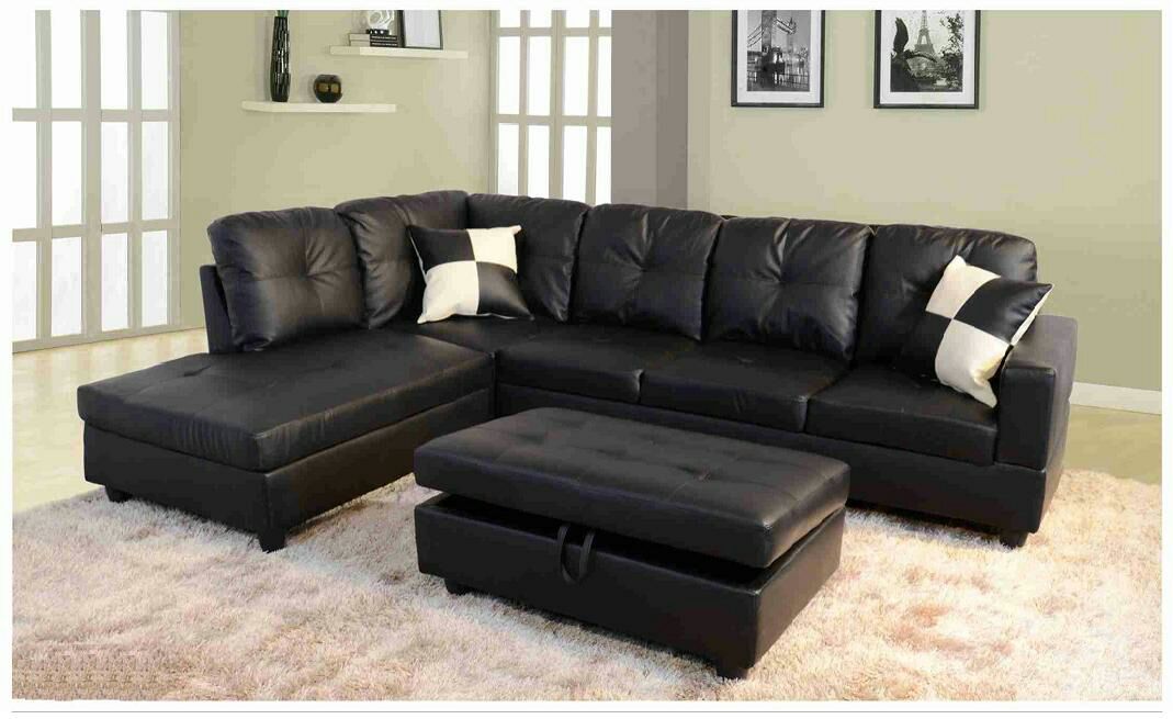 Black leather sectional with ottoman has storage ( new )