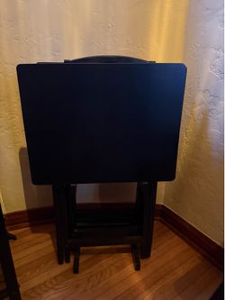 4 foldable Tv trays with stand.