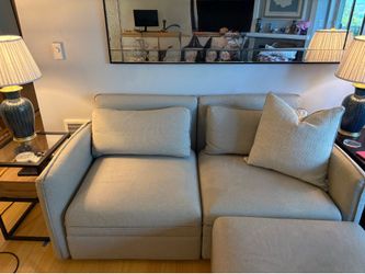 Sectional couch with ottoman that folds out into bed