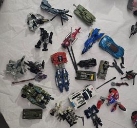 Mixed Lot of Assorted Transforming Robot Toys and Vehicles