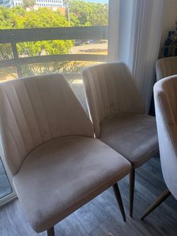 Mid-century dining chairs with plush velvety upholstery