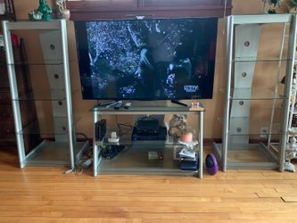 Entretaimant center for a tv 60 inch tv with two glass shelfs