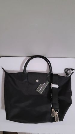 New Black longchamp bag  come w/ strap SERIOUS INQUIRIES ONLY/PLEASE DONT WASTE MY TIME IF YOUR NOT INTERESTED
