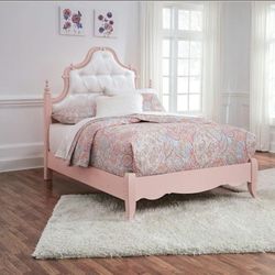 Ashley Laddi Full Upholstered Poster Bed in a white and pink finish. 