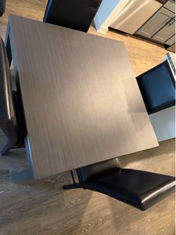 Medium Grey Square Dining Table With 4 Black Chairs