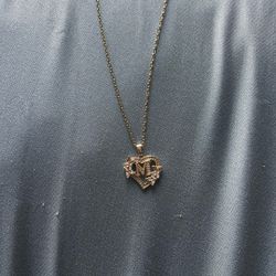 Letter M Capitalize With Flowers Surrounding It