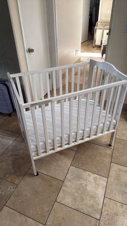 Baby crib with mattress