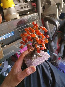 It's a tree made out of satrina gems sitting beneath some amethyst it's about 5 in tall maybe 6 in wide
