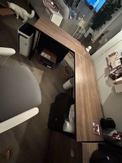 L-shaped desk with grey wood and black frame
