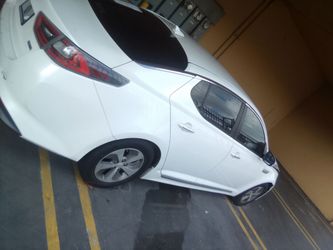 White Kia Optima Sedan hybrid