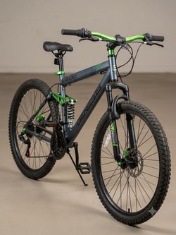Brand: Genesis  Model: V2100 (Dual Suspension Mountain Bike)  Color: Gray with green accents  Size: This model is typically found in a 26-inch wheel s