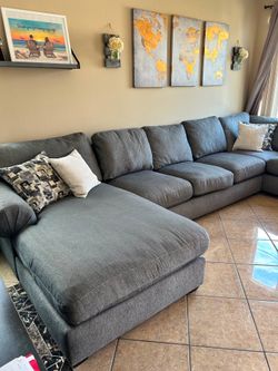 Beautiful abd super comfortable grey sectional couch from Jerome’s