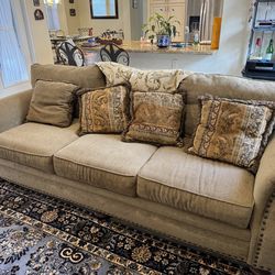 Beautiful beige, three-cushion fabric sofa featuring traditional style with nailhead trim & Accent Chair w/ Ottoman - Excellent Condition