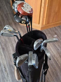 Golf clubs and cart