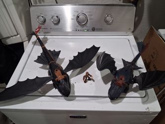 2 How to train your dragons  and 1 small figure.
