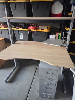 Computer desk with small cabinets that fit underneath the desk