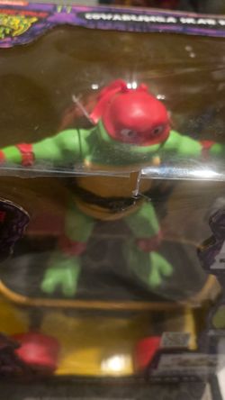 Teenage Mutant Ninja Turtles: Mutant Mayhem "Cowabunga Skate RC" Raphael remote-controlled skateboard toy.