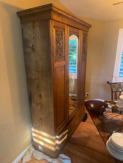 large European-style pine or softwood armoire/wardrobe only available  June 13, 14