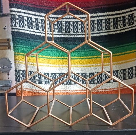 USED GOLD METAL WINE STAND