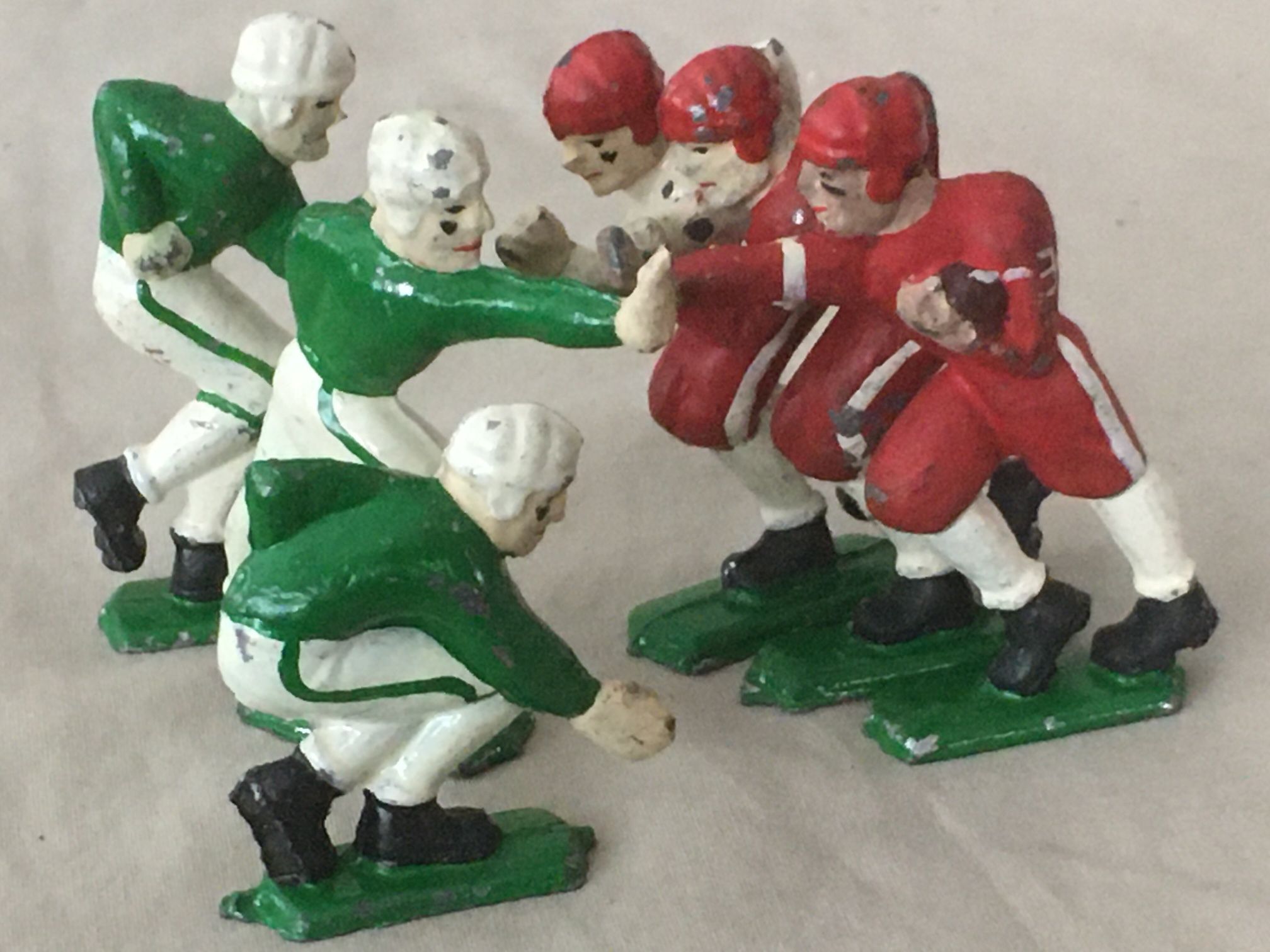 6 Antique Cast Iron Football Players