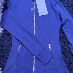 Navy blue lululemon jacket with gold zipper