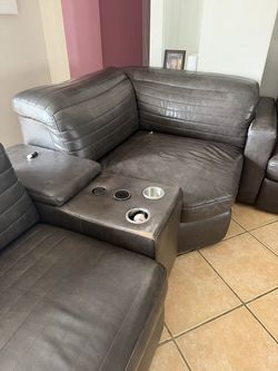 The leather sofas are free; they are small with a minor tear on the side, yet remain in good condition. You may lift and rest your feet on one of them
