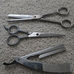Thinning shears, scissors and straight razor.