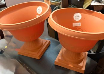12-inch resin urn planters. Set of two. Planters are orange terracotta color. Has square base and drainage holes.    📍Pick up in Brush Prarie   NE 87