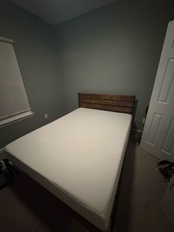 Like New Queen bed frame and mattress