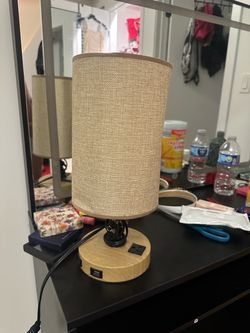 Lamp with charging station