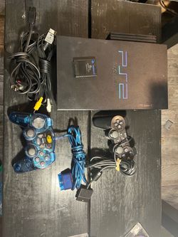Sony PlayStation 2 Console with 2 controllers and 6 games.